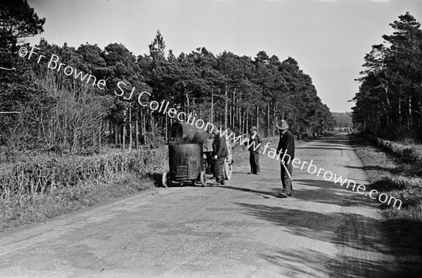 MEN REPAIRING ROAD